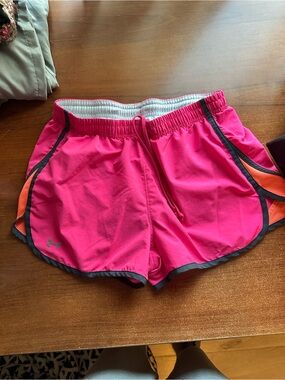 Under Armour Women's Hot Pink Athletic Shorts with Orange Accent